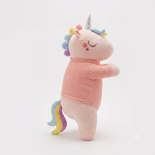 Side view of a 60cm lying pink plush unicorn highlighting the pink corduroy onesie embroidered with 'I Love You' and yellow and blue stars.