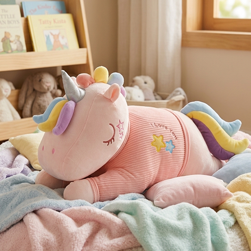 Front view of a 60cm pink sleeping unicorn plush toy with closed embroidered eyes, pastel pastel-colored mane, and a metallic silver horn.